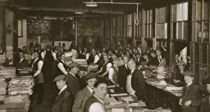 Daily Mail Prints: Newsvendors gather to pick up the next days newspapers to sell