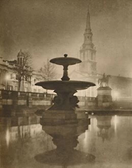 Rain Collection: Night Rain Has Turned The Pavements To A Pool of Reflections, c1935. Creator: Calkin