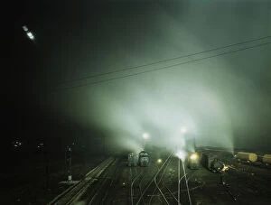 Atchison Topeka Santa Fe Railway Gallery: Night view of part of Santa Fe R.R. yard, Kansas City, Kansas, 1943. Creator: Jack Delano