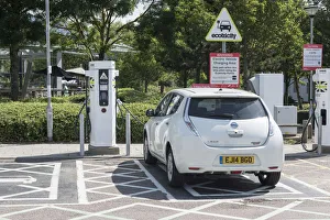 Nissan Leaf at elctric charging point 2015. Creator: Unknown