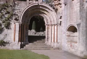Norman Arch leading to cloisters, Dryburgh Abbey, Berwick-shire, Scotland, 20th century. Artist: CM Dixon