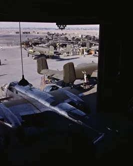 Assembly Line Methods Collection: Another North American B-25 bomber rolls off the final assembly line to join other ships... 1942