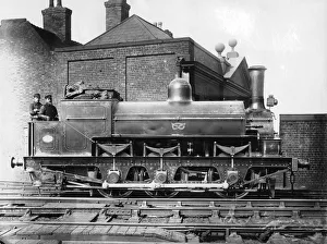 North Staffordshire 0-6-0 steam locomotive with driver and fireman on the footplate, 19th century