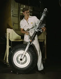 Assembly Line Methods Collection: A nose wheel and landing gear assembly for a B-25... North American Aviation, Inc. Calif. 1942