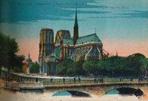 Papeghin Gallery: Notre-Dame Cathedral showing the Apse and the Pont Notre-Dame, Paris, c1920