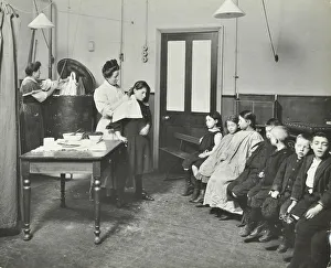 Whitechapel Prints: Nurse cutting childrens verminous hair, Finch Street Cleansing Station, London, 1911