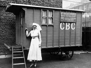 Family Planning Prints: Nurse outside a Marie Stopes mobile birth control clinic, London, 1928. Creator: Unknown