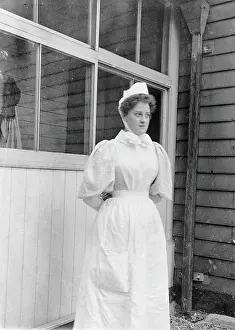 Smallpox Prints: Nurse standing outside an isolation hospital, possibly at Ilford, Essex. Creator: Unknown