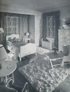 Nursery Prints: Nursery by W. & J. Sloane, with cream-coloured furniture and shaggy white rugs