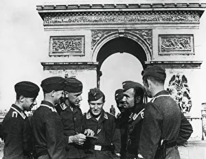 Occupied Prints: Occupying German troops at the Arc de Triomphe, Paris, June 1940