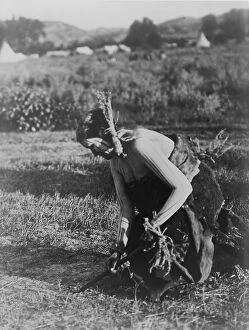 Ceremonial Collection: Offering the pipe to the Earth-Cheyenne, c1910. Creator: Edward Sheriff Curtis
