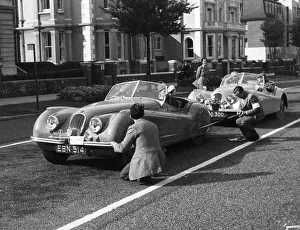 Officials measuring Jaguar XK120, 8 clubs rally Eastbourne 1952. Reg EBN 514. Creator: Unknown Officials measuring Jaguar XK120, 8 clubs rally Eastbourne 1952. Reg EBN 514. Creator: Unknown
