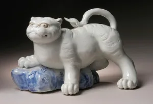 Underglaze Prints: Okimono in the Form of a Tiger Climbing onto a Rock, 19th century. Creator: Unknown