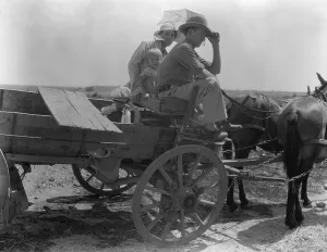 Okie Prints: Oklahoma roadside encounter day laborers, 1936. Creator: Dorothea Lange