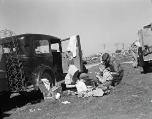 Sharecropper Prints: Oklahomans bound for Oregon along a highway in California, 1937. Creator: Dorothea Lange