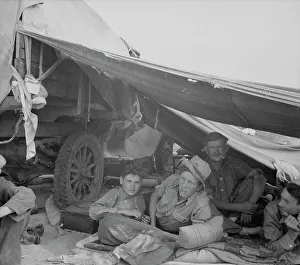Camping Out Prints: Oklahomans in potato pickers camp near Shafter, California, 1937. Creator: Dorothea Lange