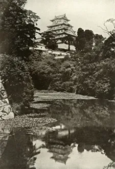 Water Surface Prints: An Old Feudal Castle from the Moat, 1910. Creator: Herbert Ponting