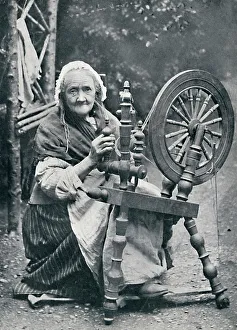 Elderly Prints: An old Irish woman at her spinning-wheel, 1912. Artist: W Lawrence