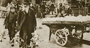 Immigrant Gallery: Old Jewish man and his grandson carrying some fowls, Wentworth Street, Stepney, 20th century