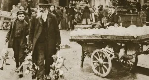 Old Jewish man and his grandson carrying some fowls, Wentworth Street, Stepney, 20th century