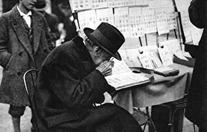 Flammarion Prints: An old purchaser of stamps, Paris, 1931. Artist: Ernest Flammarion