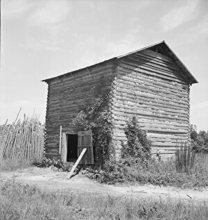 The old tobacco barn (new one under construction.), Chatham County, North Carolina, 1939. Creator: Dorothea Lange