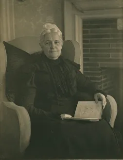 Platinum Prints 1900 Gmgpc Prints: Old woman in an armchair, with an open book in her lap, c1900. Creator: Mathilde Weil