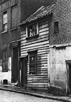 Terraced House Prints: An old wooden house in St Johns Hill, Shadwell, London, 1926-1927. Artist: Whiffin