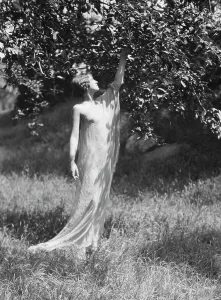 Portrait Photographs Prints: Olson, Margaret, Miss, standing outdoors, 1924 July. Creator: Arnold Genthe