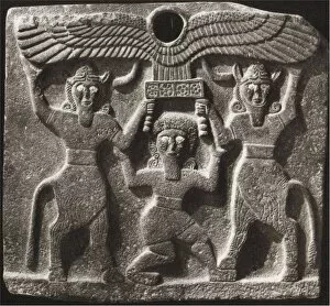 Assyrian Art Gallery: Orthostates depicting Gilgamesh between two minotaur demigods holding up the sun disc. From Tell Hal