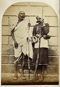 South Asian Prints: Oude, India: two men holding long sticks, c1860. Creator: Unknown