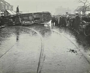 Wandsworth Collection: Overturned electric tram and onlookers, London, 1913