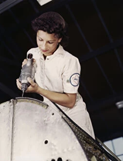Mechanic Gallery: Oyida Peaks riveting as part of her NYA training...Naval Air Base, Corpus Christi, Texas, 1942