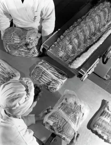 Packing bacon rashers, Danish Bacon Company, Selby, North Yorkshire, 1964. Artist