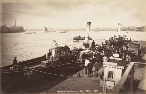Passenger Steamer Prints: A paddle steamer disembarking passengers at Greenwich Pier, London, c1890. Artist