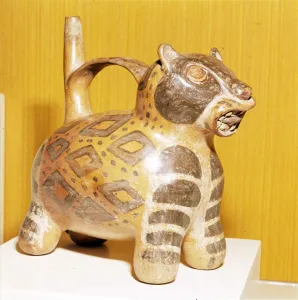 Painted pottery Bridge and Spout vessel in the form of a Jaguar, Tiahuanaco, Peru, 100-600 Painted pottery Bridge and Spout vessel in the form of a Jaguar, Tiahuanaco, Peru, 100-600