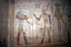 Anubis Collection: Painted relief of Sethos before Anubis, Temple of Sethos I, Abydos, Egypt, 19th Dynasty, c1280 BC