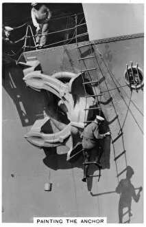 Aircraft Carrier Gallery: Painting the anchor of the aircraft carrier HMS Courageous, 1937