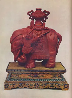 Qianlong Period Prints: One of a pair of carved red lacquer elephants, Chinese, Qianlong Period, c1765