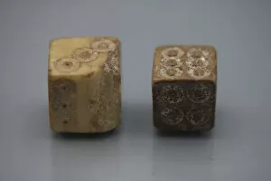 A pair of Roman dice made from carved bone, 1st century BC