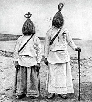 A pair of straw boys, Ireland, 1922.Artist: AW Cutler
