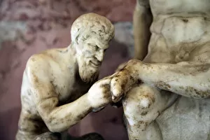 Pan and satyr, Pan removing a splinter from a satyrs foot