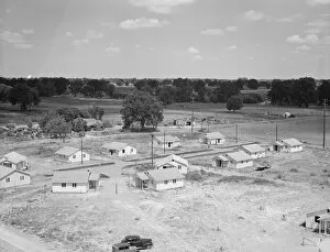 Refugee Gallery: Partially completed homes for agricultural workers... Farmersville, California, 1939