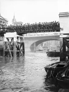 Commuting Prints: Passengers for the river bus service on the footbridge to London Bridge Pier