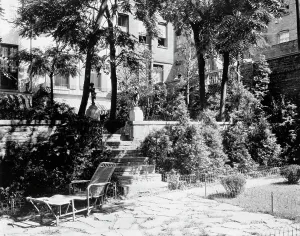Rowhouse Prints: Patio and gardens in New York City, 1921. Creator: Frances Benjamin Johnston