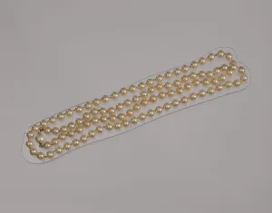 Mae Reeves Prints: Pearl necklace from Maes Millinery Shop, 1941-1994. Creator: Unknown