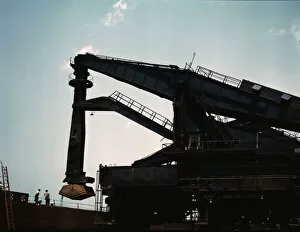 Pennsylvania R.R. ore docks, unloading iron ore from a lake freighter... Cleveland, Ohio, 1943. Creator: Jack Delano