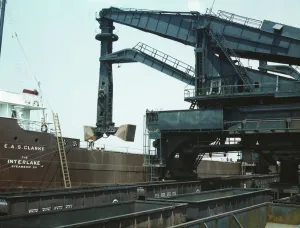 Pennsylvania R.R. ore docks, unloading ore from a lake freighter... Cleveland, Ohio, 1943. Creator: Jack Delano