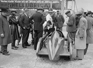 People examining Leon Cushmans Austin 7 racer at Brooklands for a speed record attempt, 1931