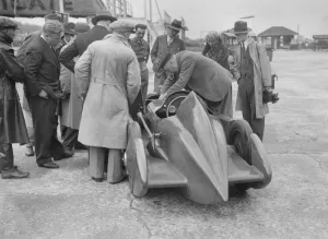 People examining Leon Cushmans Austin 7 racer at Brooklands for a speed record attempt, 1931